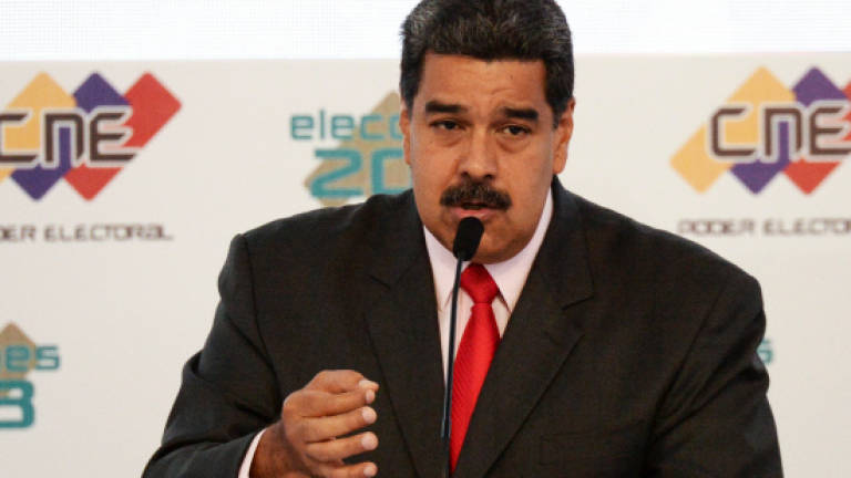 Venezuela's Maduro expels US diplomats, rejects sanctions