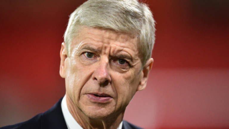 Battered Wenger searches for redemption