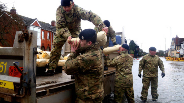 Britain braces for more floods after violent storm