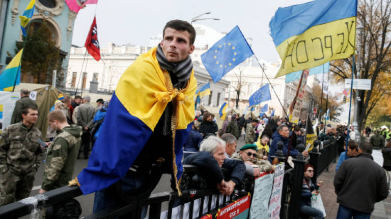 Ukraine makes first move to meet protester demands