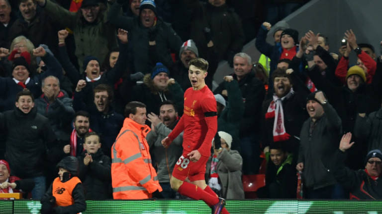 Woodburn makes history as Liverpool move into League Cup semis