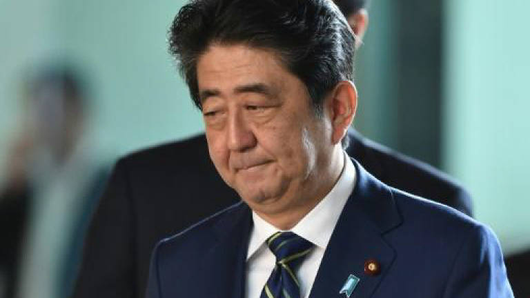 Japan PM Abe chastened by huge loss in Tokyo assembly vote