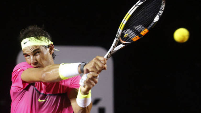 Defending champion Nadal advances in Rio