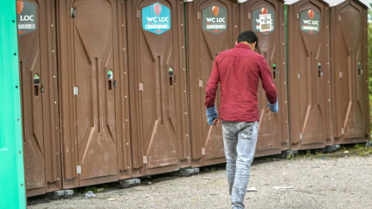 France provides loos, taps for Calais migrants