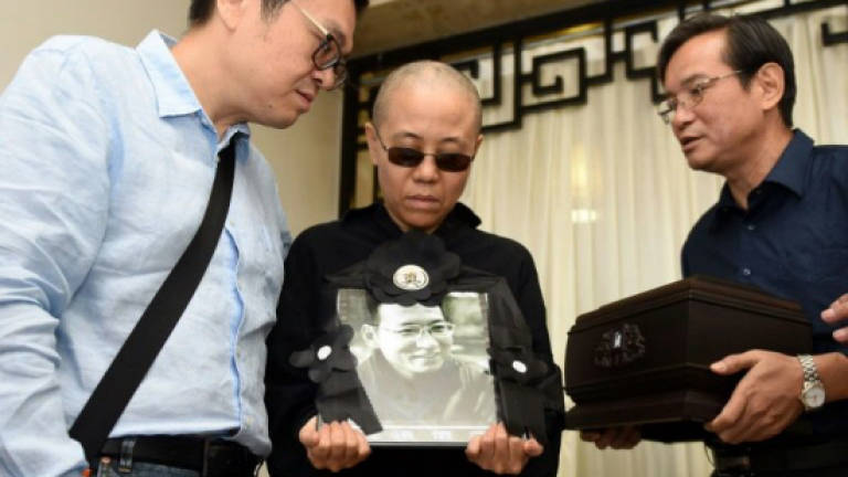 Fate of Chinese dissident's widow worries friends