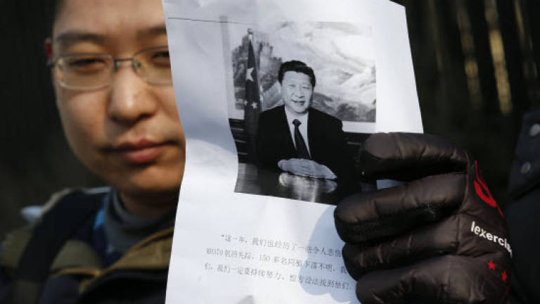 MH370 relatives protest outside Malaysian embassy in Beijing
