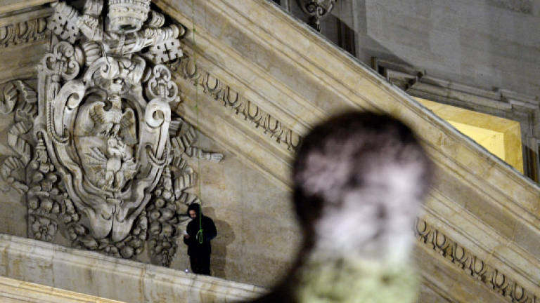 Italian protester climbs St Peter's Basilica again