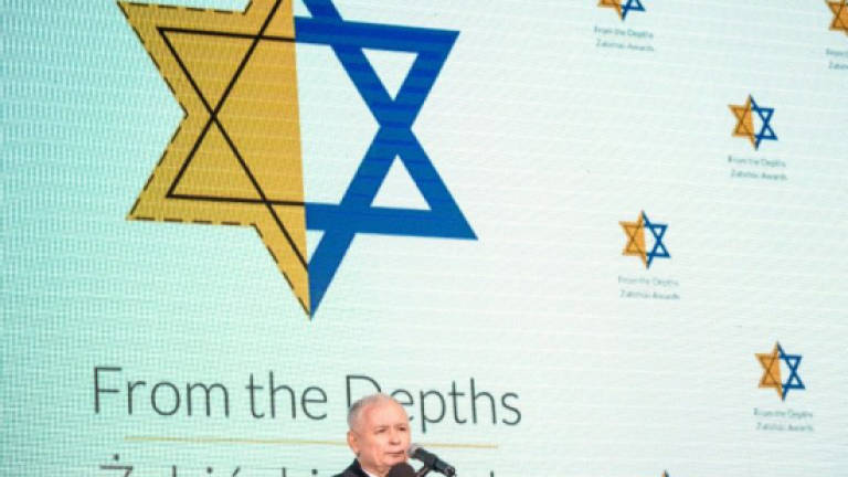 Poland's leader condemns anti-Semitism, praises Israel