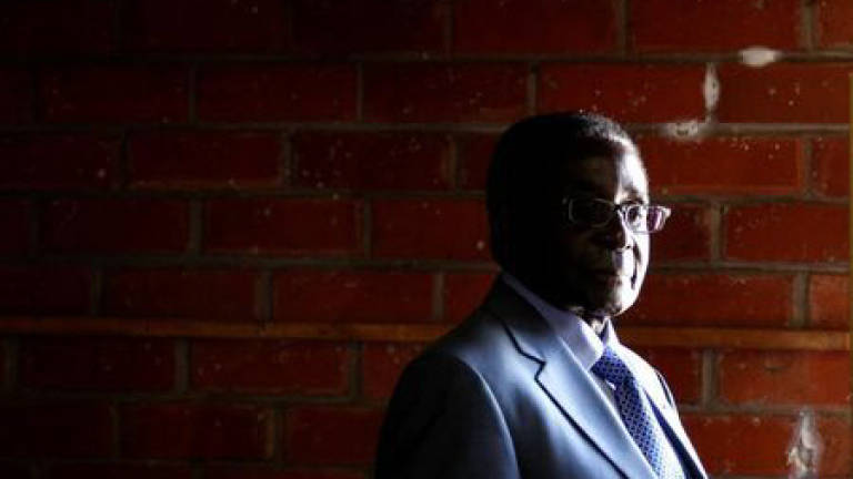 Mugabe in Singapore for first trip since ouster