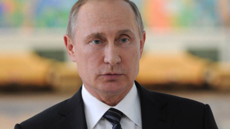 Putin jokes he's 'offended' not to be on US 'Kremlin list'