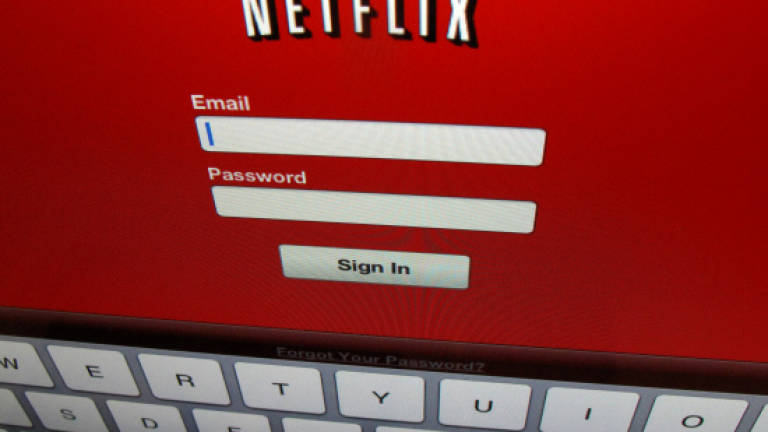 Netflix reassures with growth but hits pause in China