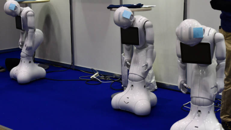 Japan shows off disaster-response robots at android fair