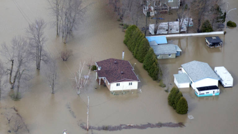 Canada's army rolls in after devastating floods
