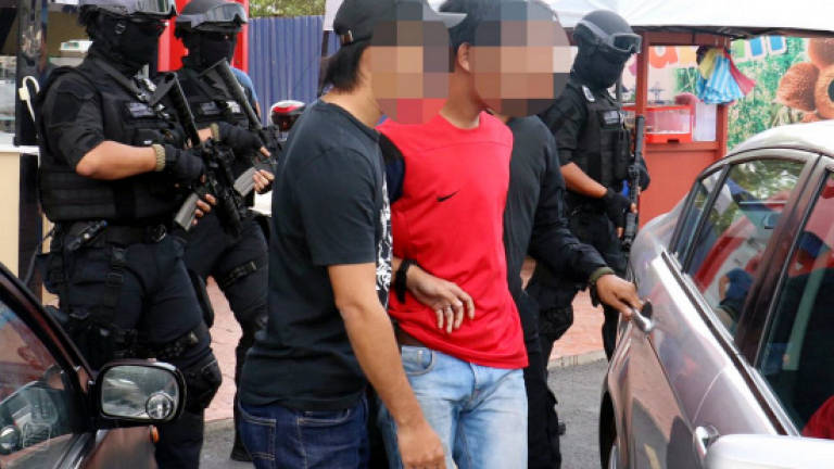 Immigration officer among seven arrested for aiding terrorists