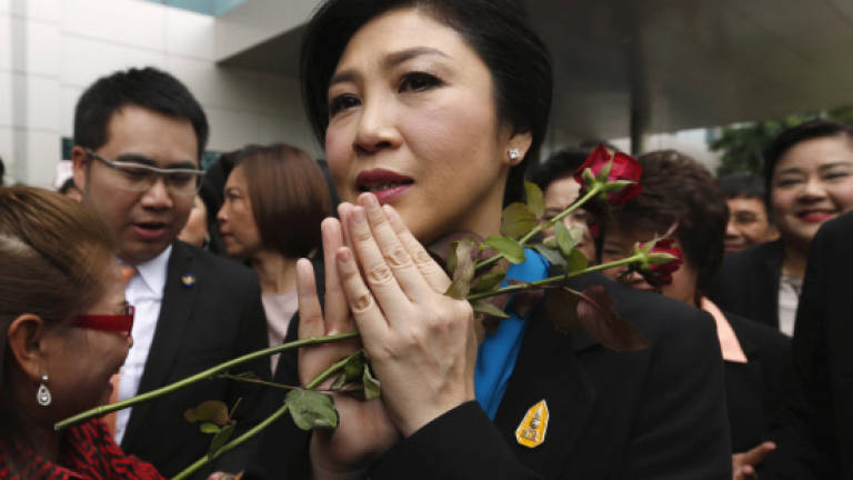 Yingluck appears at court over rice subsidy scheme