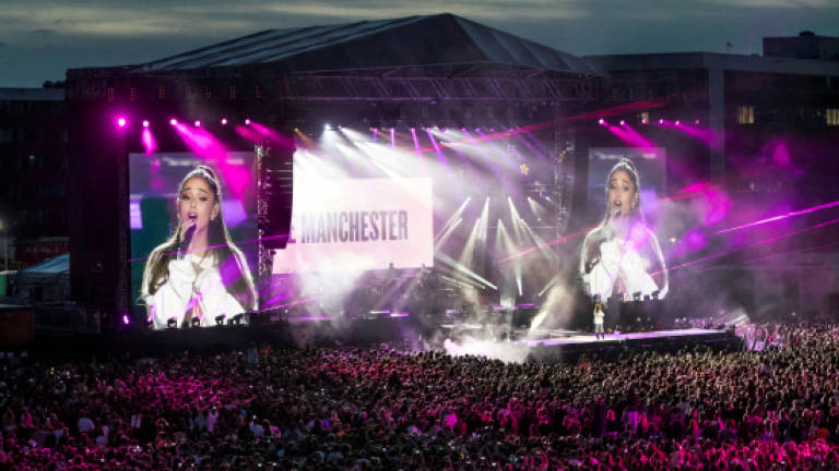 Ariana Grande resumes tour in Paris amid tight security