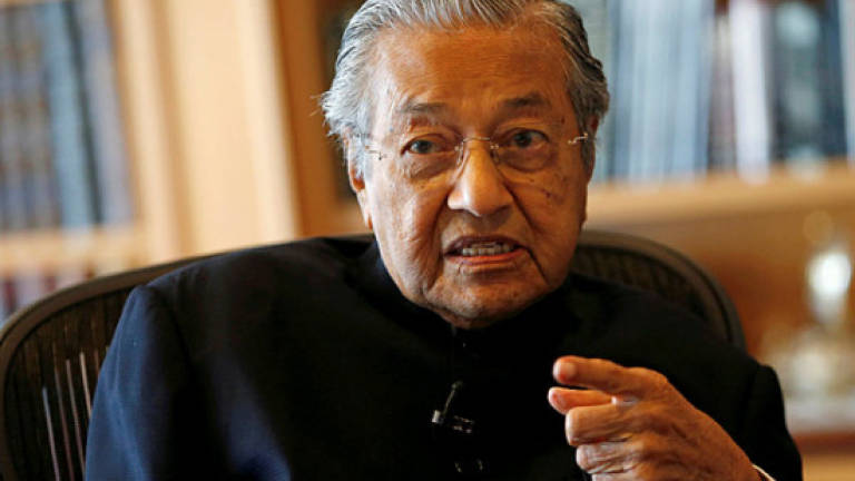 They were paid and trained to riot, says Mahathir