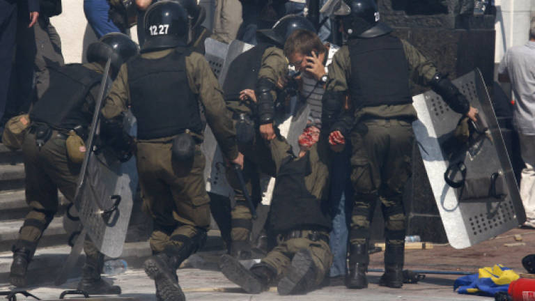 Ukraine reels from clashes as third policeman dies (Updated)