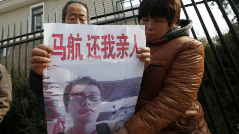 MH370 relatives protest outside Malaysian embassy in Beijing