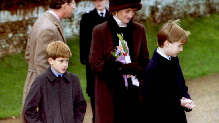 British princes William and Harry re-dedicate grave of mother Princess Diana