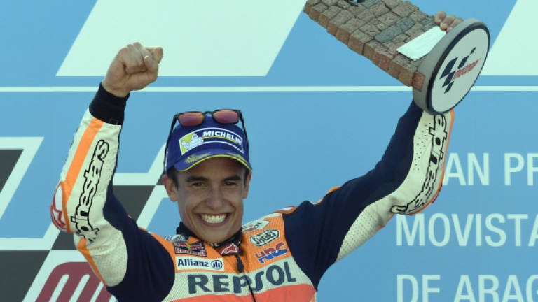 Marquez surges into title lead with Aragon win