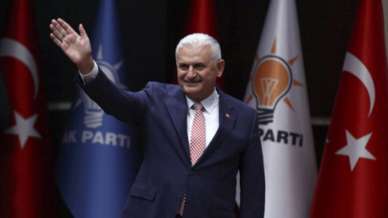 Turkey names new PM as Erdogan tightens grip