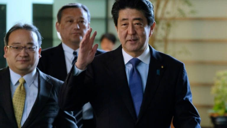 Pressure grows on Japan's Abe over scandal as support melts