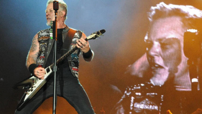 Action vowed for refugees in concert led by Metallica, Rihanna
