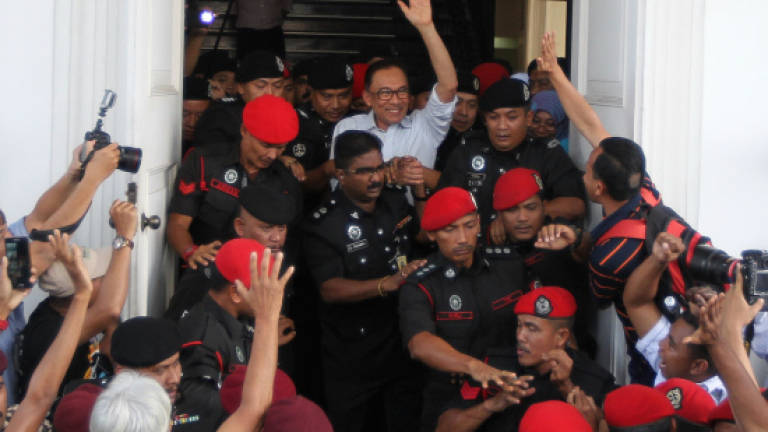 Anwar's suit against NST settled