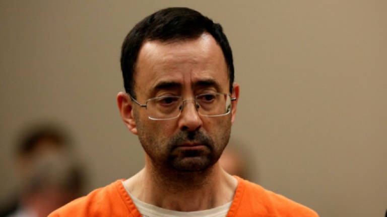 Former US gymnastics doctor pleads guilty to sex abuse