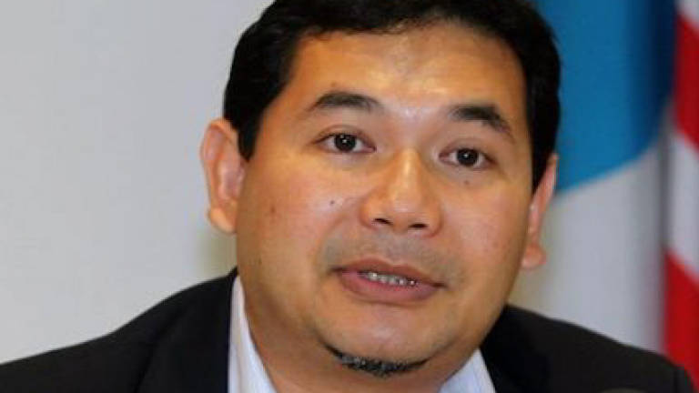 Rafizi claims trial to amended charge