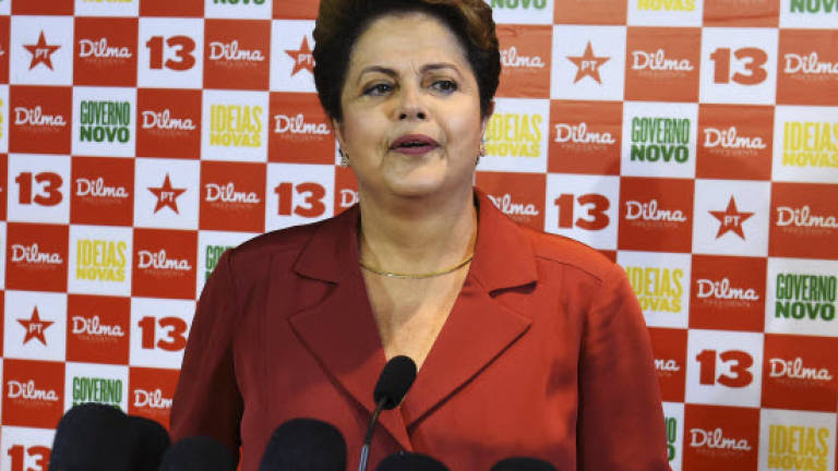Brazilian presidential polls open with Rousseff as narrow favourite