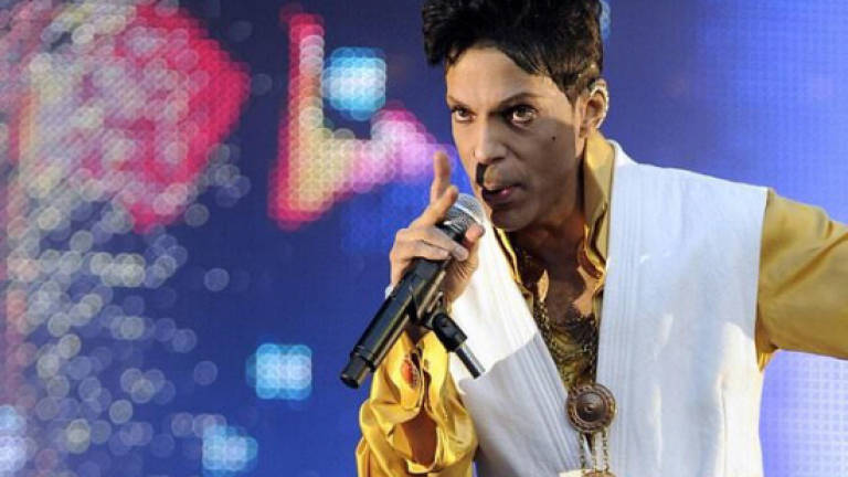 Prince's glittering outfits, guitars go on sale