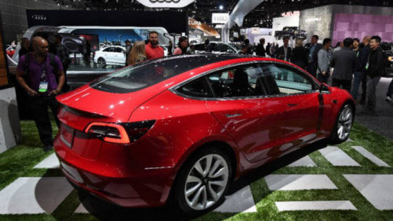 Tesla reorganizing to speed up production