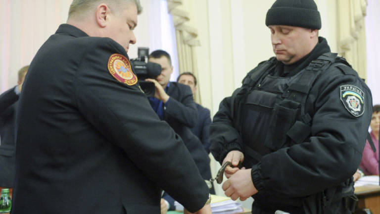 Ukraine arrests officials on live TV
