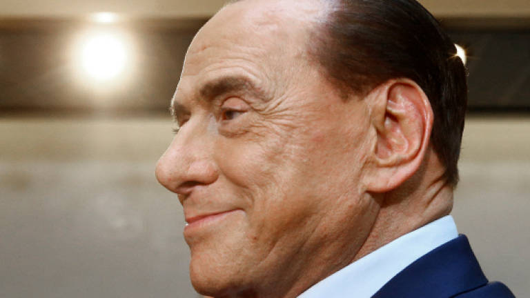 Berlusconi ordered to trial over alleged witness tampering