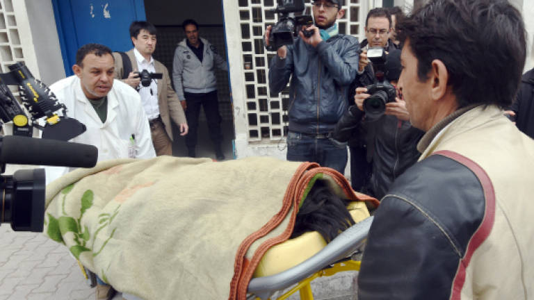 Third Tunisia museum attacker 'on the run'