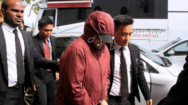 Former SWD deputy director pleads not guilty to 146 counts of money laundering, involving more than RM32m