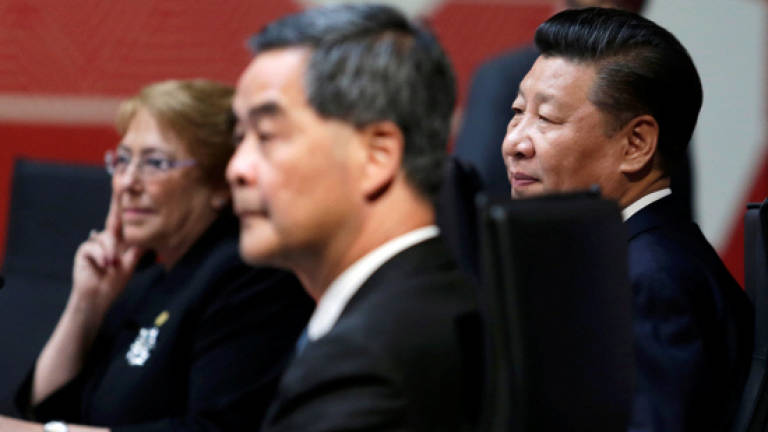 China's Xi calls on HK leader to maintain stability