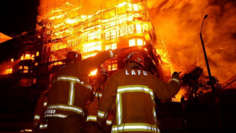 Factories razed in fire