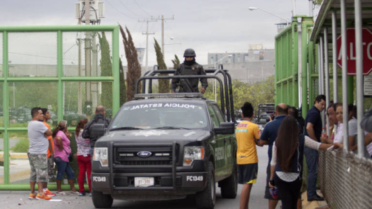 Thirteen dead in Mexican prison as authorities put down riot