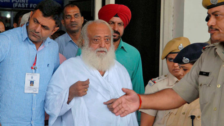Indian court jails popular guru for life over teen rape (Updated)