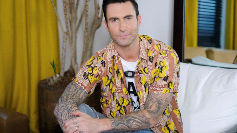 In tense times, Maroon 5 doesn't want protest songs