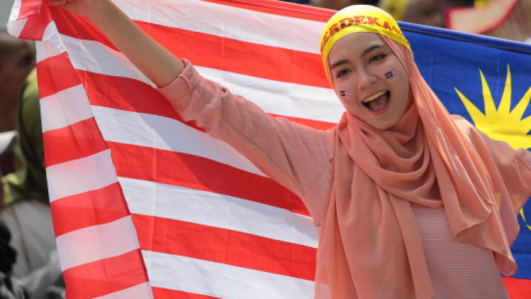 Malaysia marks National Day in a show of love, solidarity