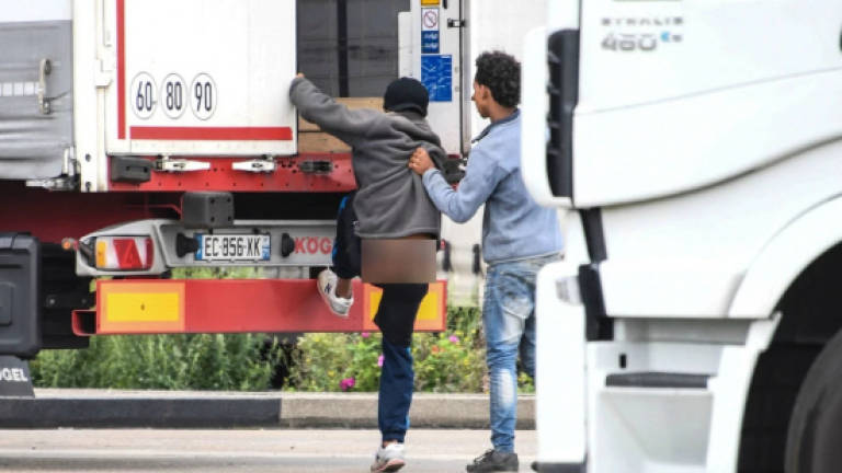 Toddler among 26 migrants found in refrigerated lorry in N. France