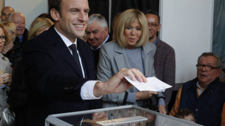 Frontrunners Macron, Le Pen vote in French election