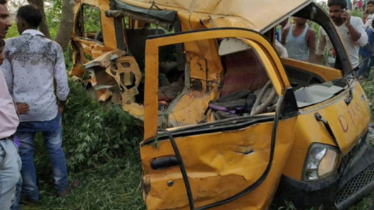 13 children dead after train hits school bus in India