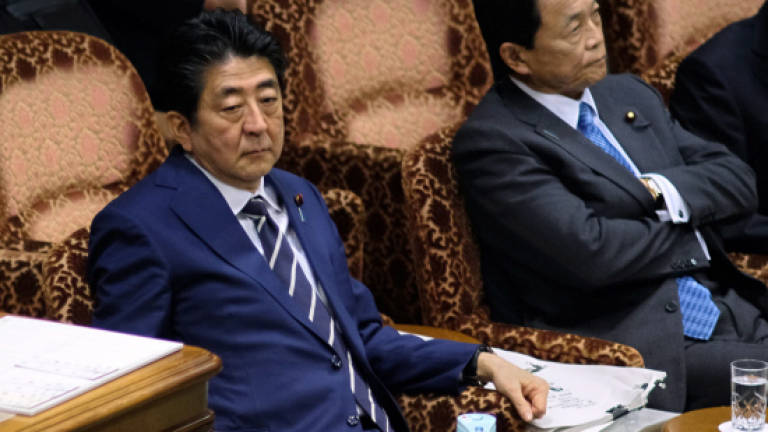 Japan ministry admits altering documents in scandal dogging Abe