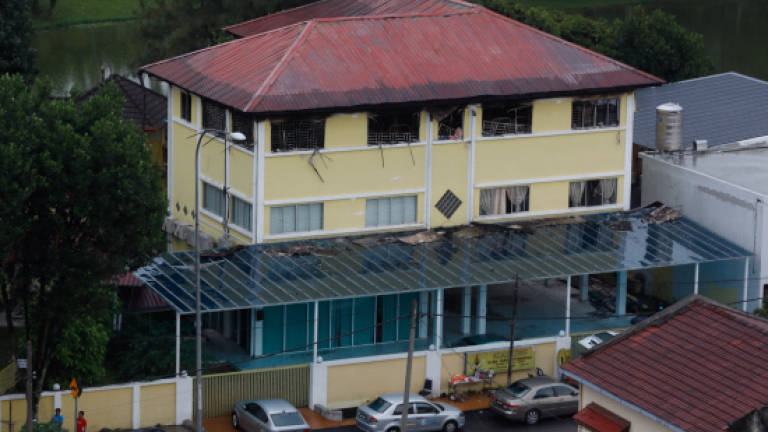 Investigating team from Bukit Aman inspects razed tahfiz centre