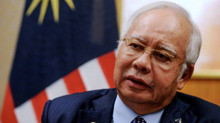 Najib gets extension of interim injunction against Pua
